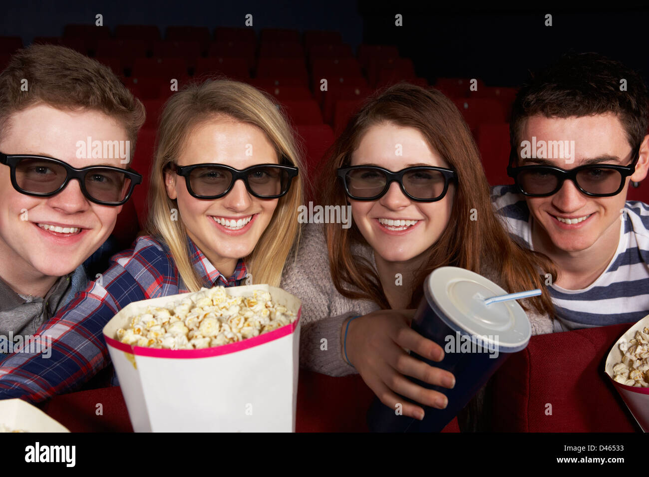 Group Of Teenage Friends Watching 3D Film In Cinema Stock Photo