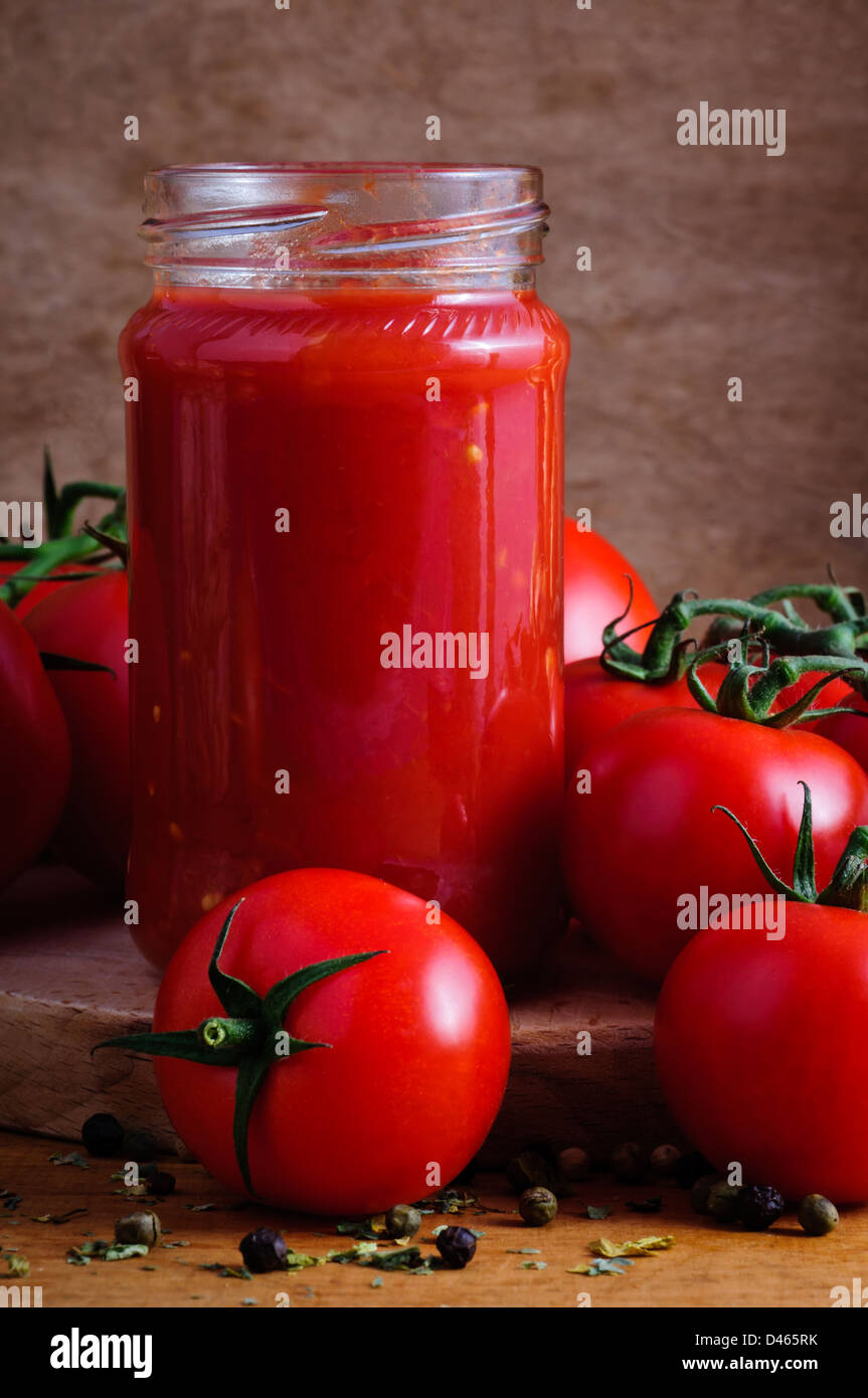 Traditional homemade tomato sauce and tomatoes Stock Photo