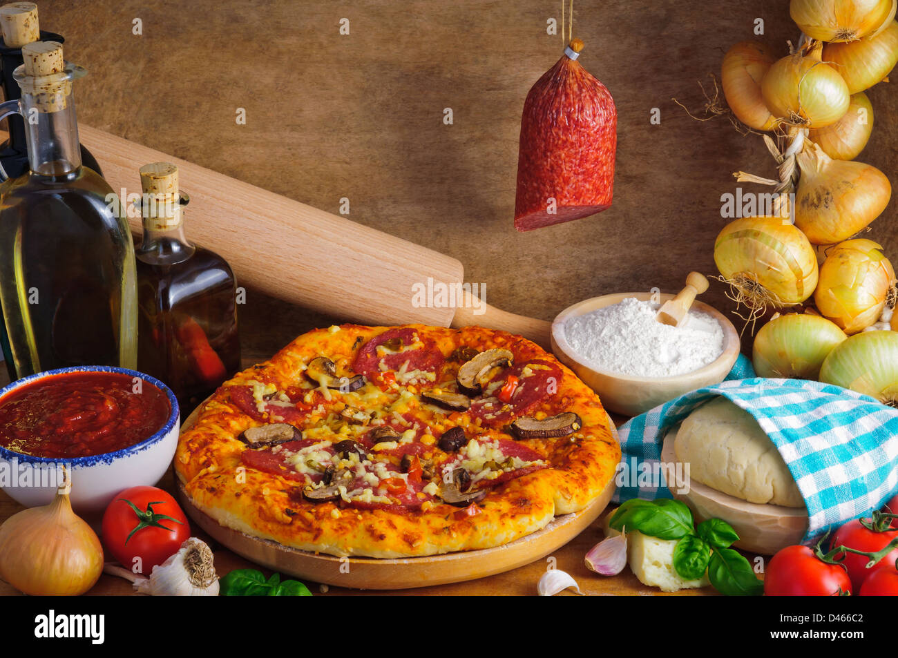 Traditional homemade salami pizza with ingredients Stock Photo