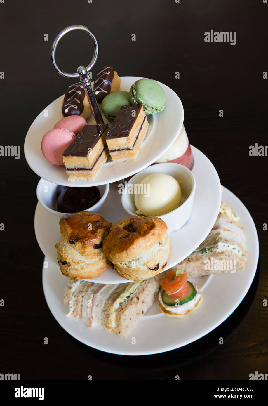 Afternoon tea with sandwiches and cakes Stock Photo