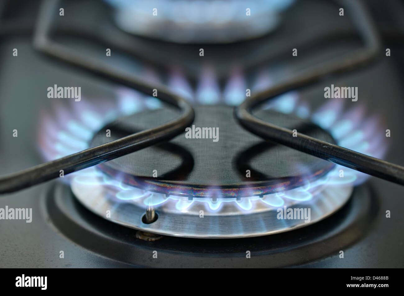 Close-up of burning gas rings on a hob Stock Photo