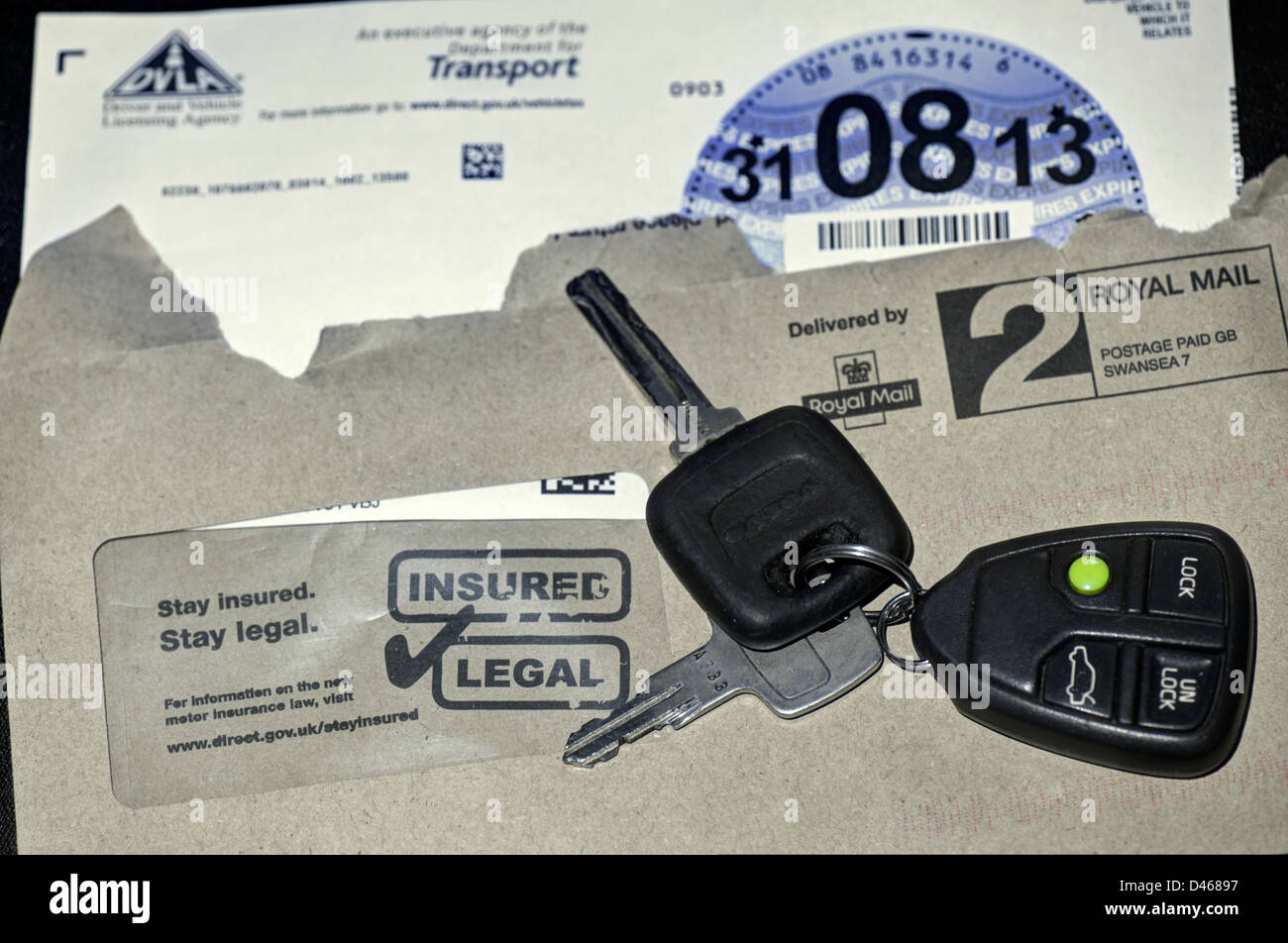 A set of car keys and a newly-issued road fund licence Stock Photo