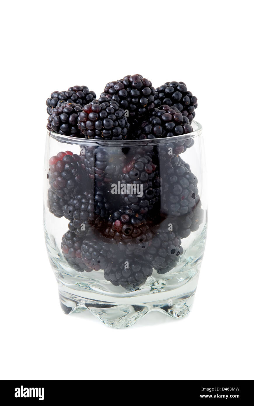 Blackberries in a glass are photographed on a white background Stock Photo