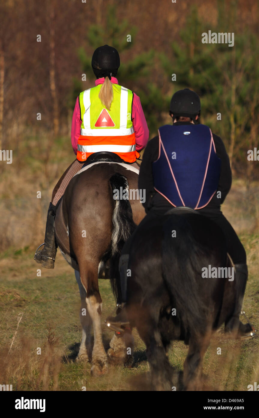 Horseriders in reflective, high visibility, protective clothing Stock Photo