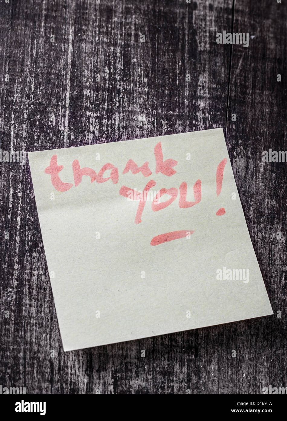 Thank you written on a post it note. Stock Photo