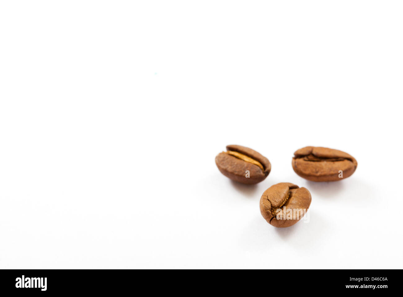 coffee beans close up isolated on white Stock Photo - Alamy