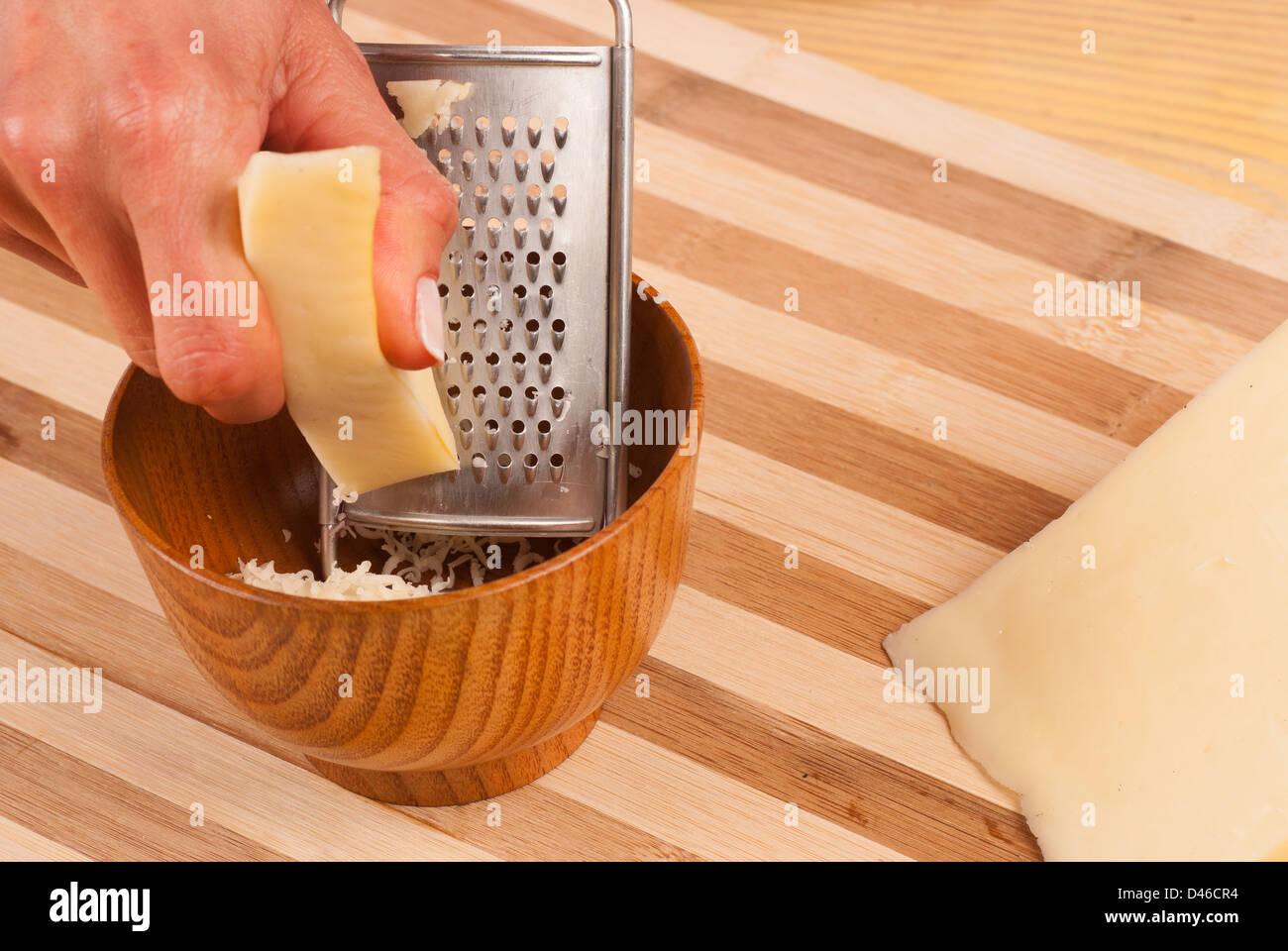 Grating cheese for the extra fresh flavor Stock Photo Alamy