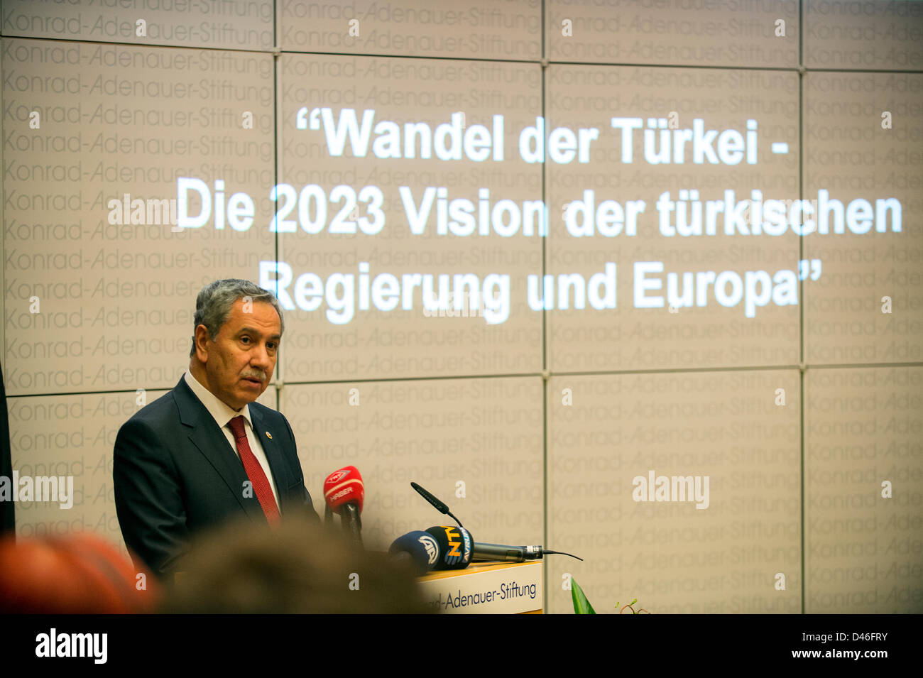 Berlin, Germany. 6th March, 2013.  Deputy Prime Minister of Turkey Bülent Arinç gives a speech about the 2023 Vision of the Turkish Government and Europe. the session was stoped by some protesters from TGB (Turkish Youth Union) against the current policy of Turkey.Credits: Credit:  Gonçalo Silva / Alamy Live News. Stock Photo