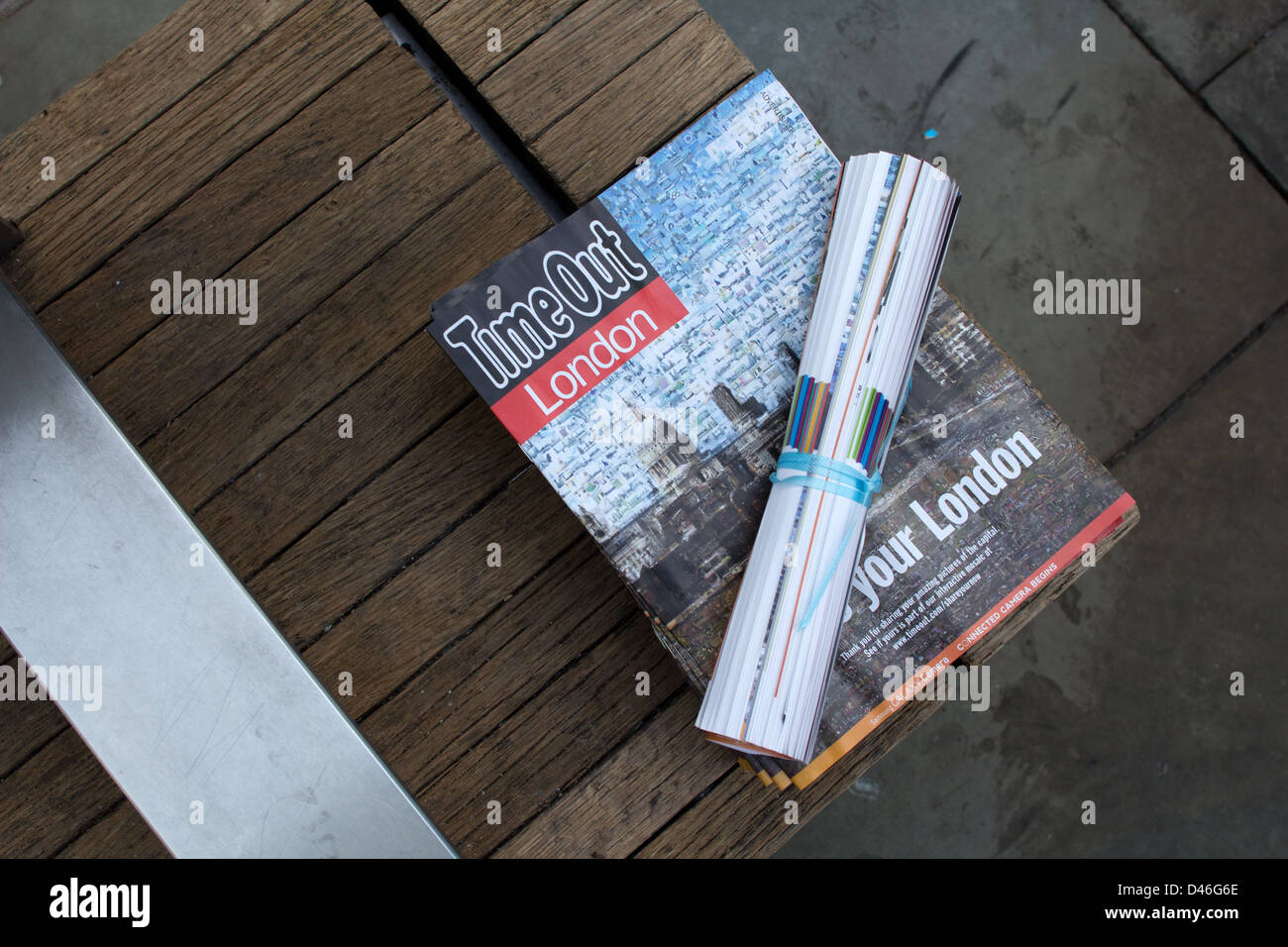 Copies of the free listing magazine Time Out, left out for collection by passers-by in central London. Stock Photo