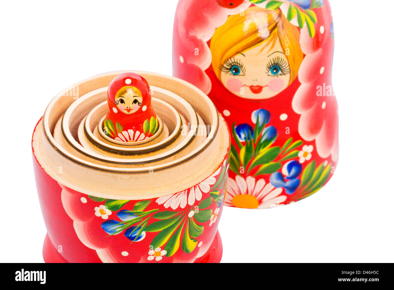Small red Matryoshka doll nested in the big one (close up) Stock Photo