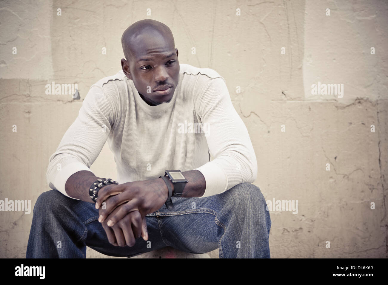 Portrait of handsome young black man with problems Stock Photo