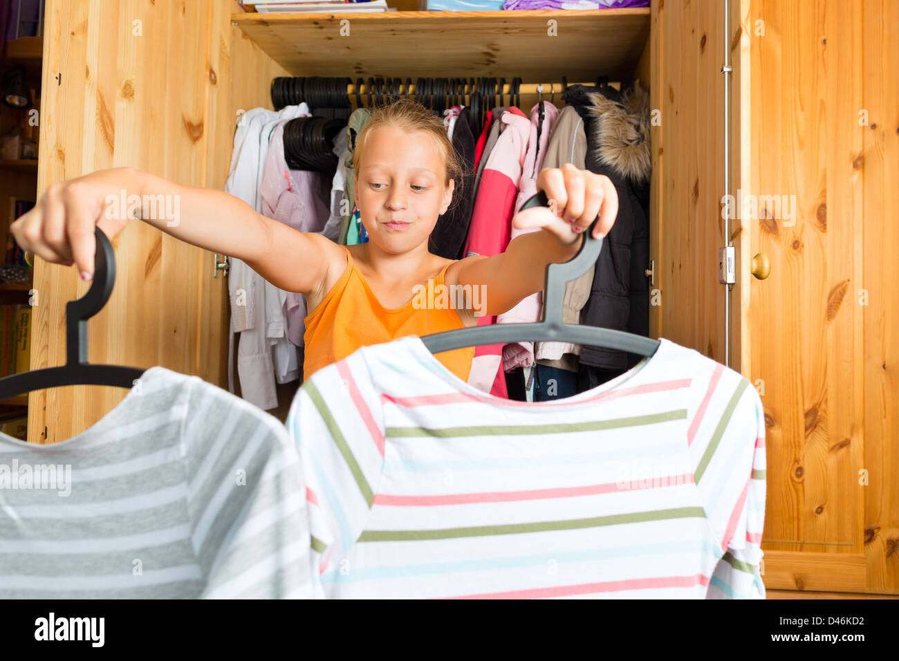 Clothes hangers child wardrobe hi-res stock photography and images - Alamy