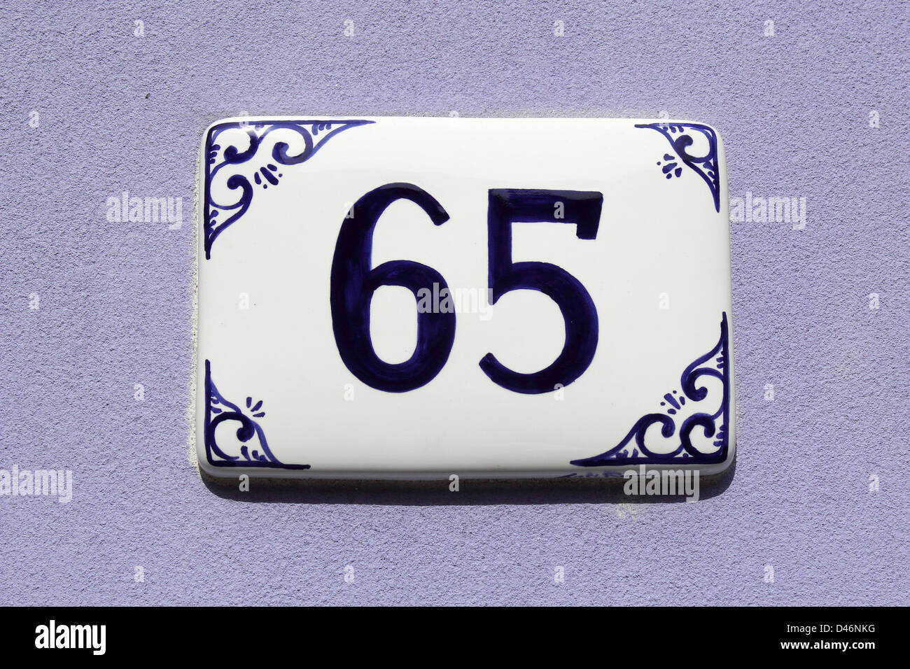 number sixty-five, house address plate number Stock Photo