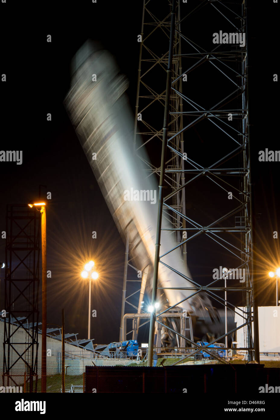 A Falcon 9 rocket from SpaceX is erected at Cape Canaveral Air Force Station in Florida for the CRS-2 mission. The rocket, designed to transport supplies to the International Space Station, was prepared for launch in support of NASA's commercial resupply services program. Stock Photo