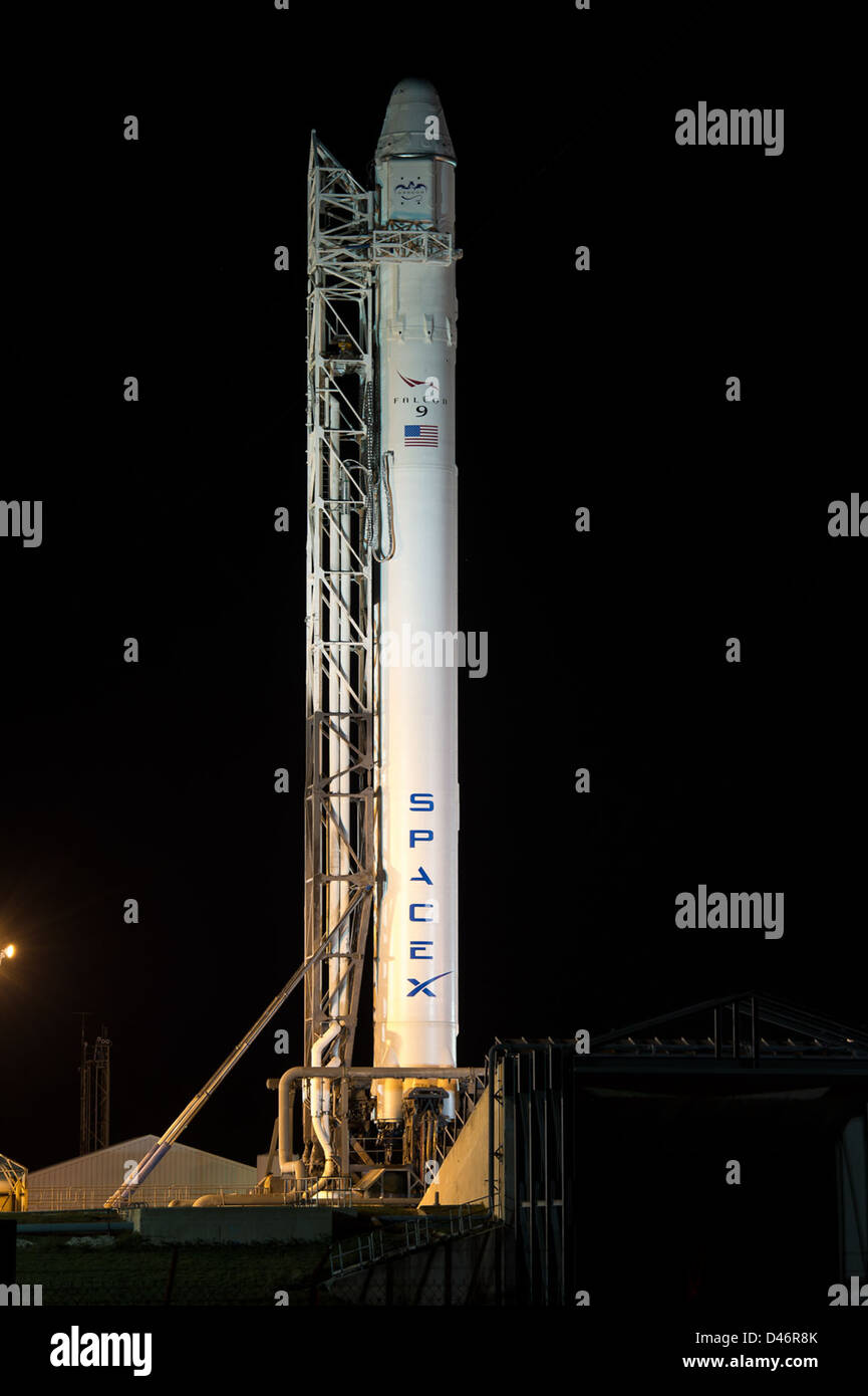 SpaceX Falcon 9 rocket is erected at Cape Canaveral Air Force Station for the CRS-2 mission. The event marks a significant milestone in commercial cargo transport to the International Space Station. Stock Photo