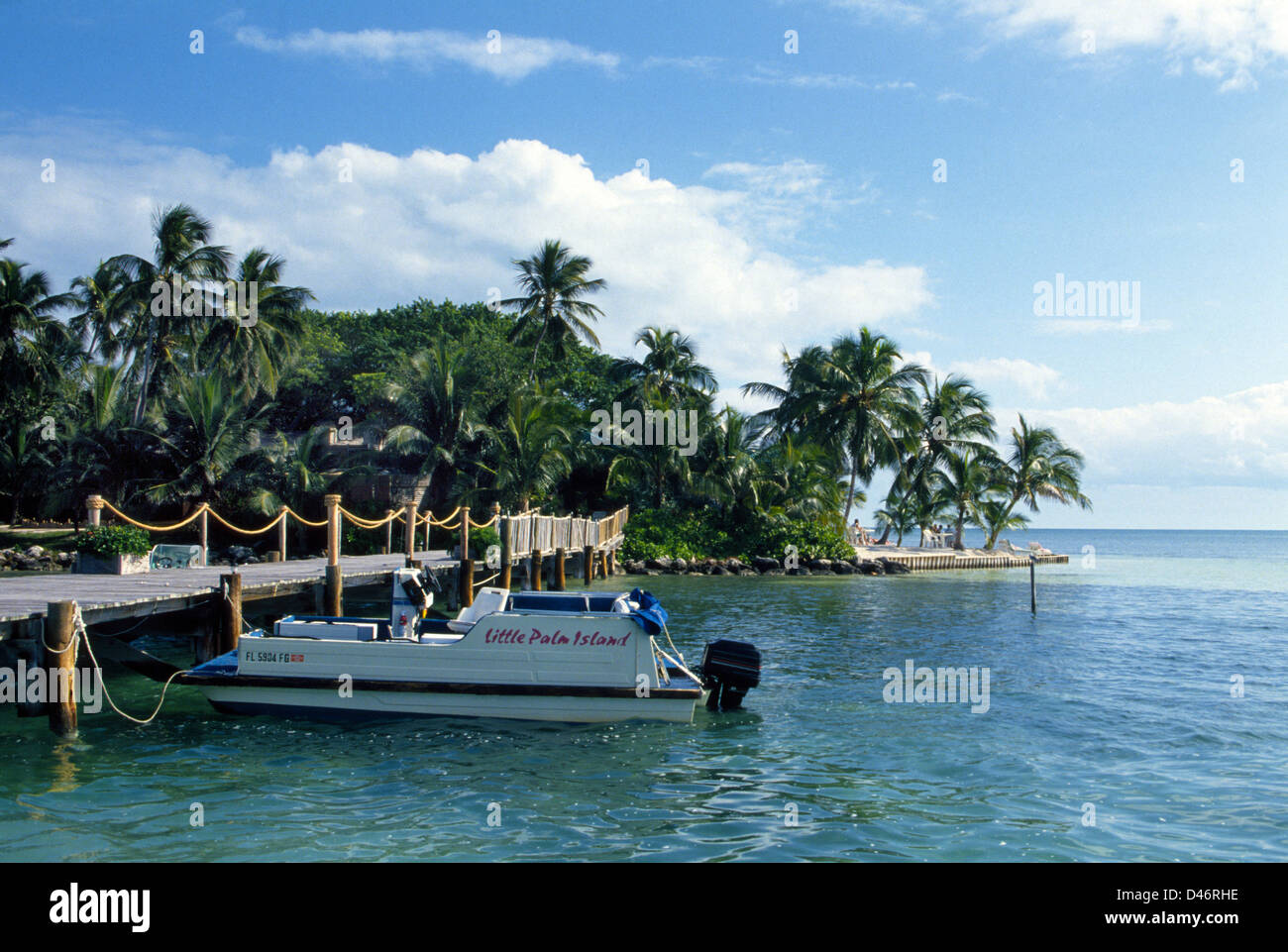 Guests enjoy tropical accommodations at Little Palm Island Resort, a brief boat ride from Little Torch Key in the Florida Keys. Stock Photo