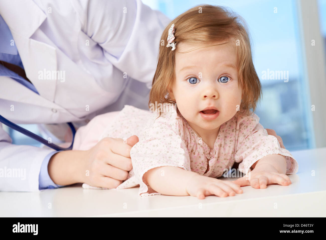 Cute baby being examined in hospital Stock Photo