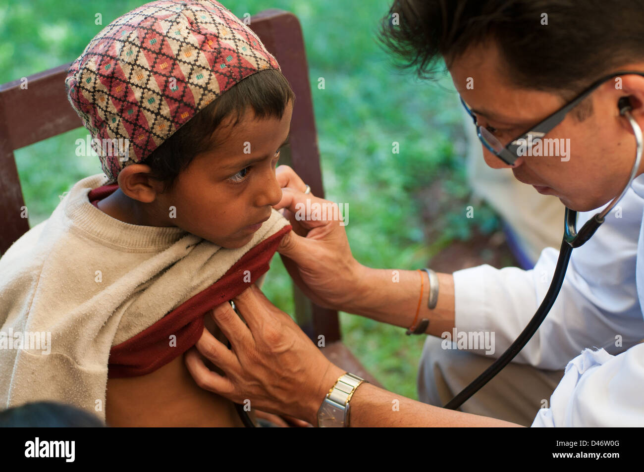 Young Nepalese boy having a health check in Eastern Nepal Stock Photo