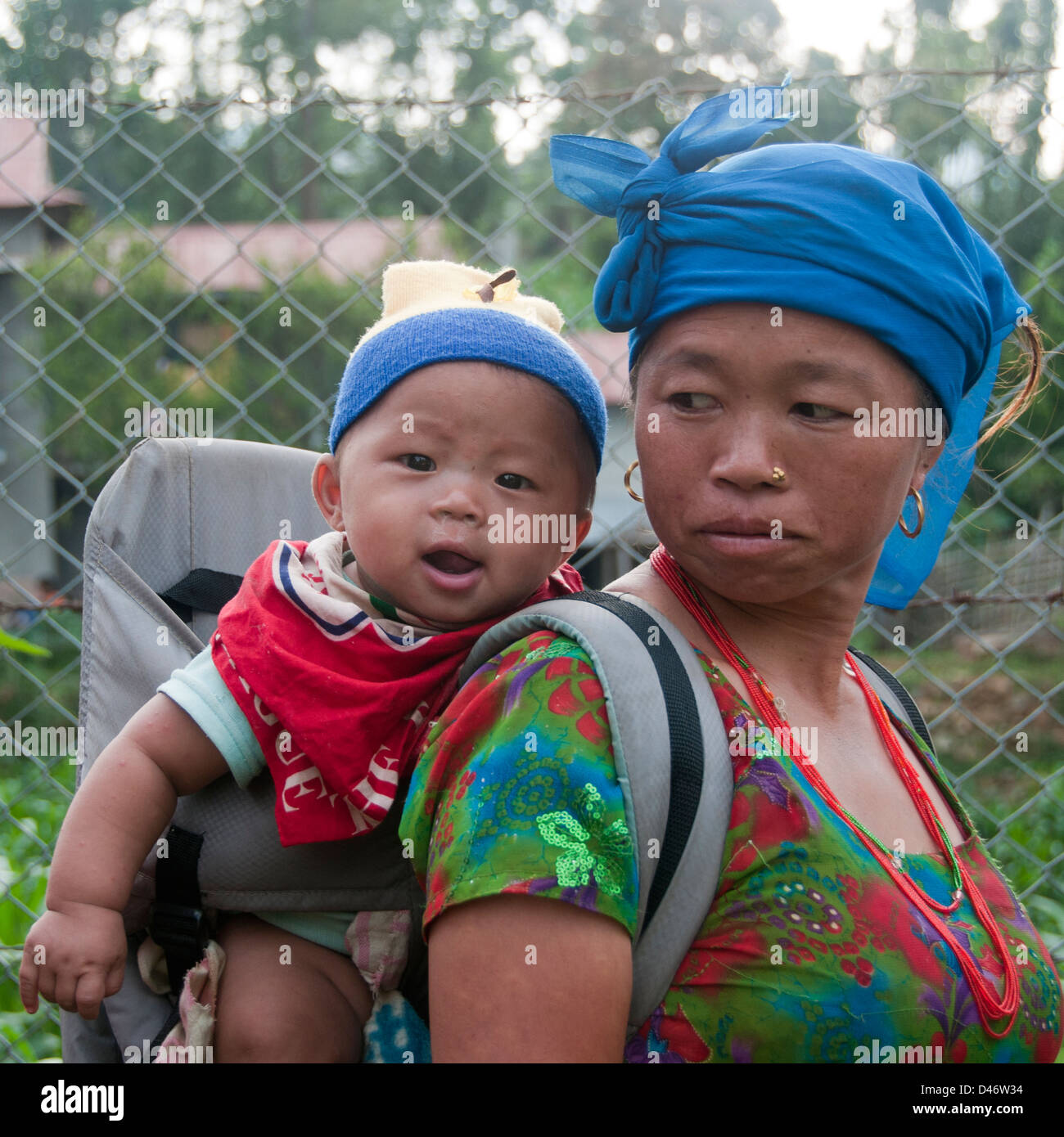 Mother carrying baby in Nepal Stock Photo Alamy