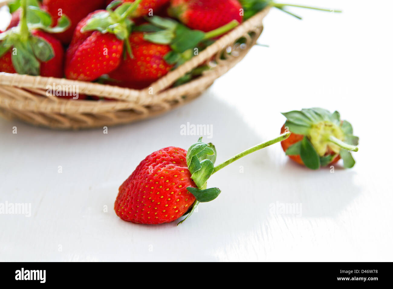 Fresh Strawberries in a bamboo basket Stock Photo