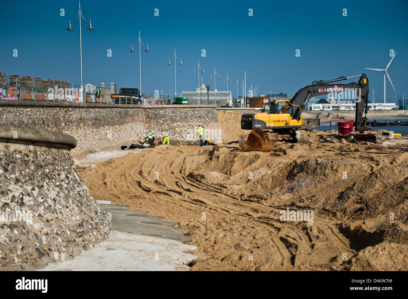 Repair work being carried out on the seawall at Lowestoft's south beach. Gulliver shown in the background. Stock Photo