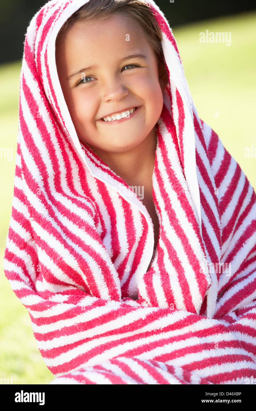 Girl Wrapped In Towel Sitting In Garden Stock Photo - Alamy