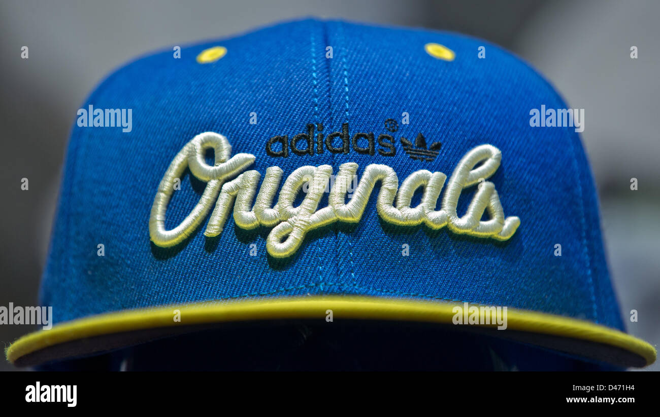 The adidas logo is seen on a cap during the company's financial statement  press conference in Herzogenaurach, Germany, 07 March 2013. Photo: DANIEL  KARMANN Stock Photo - Alamy