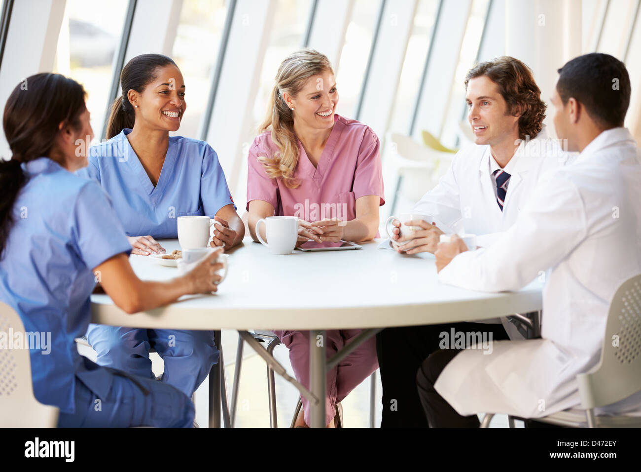 Medical Staff Chatting In Modern Hospital Canteen Stock Photo Alamy