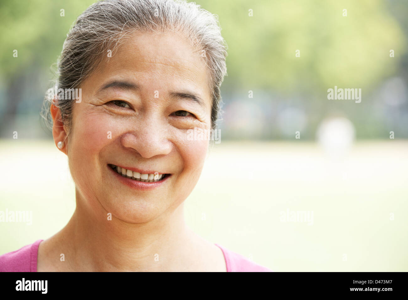 Head And Shoulders Portrait Of Attractive Chinese Senior Woman Stock ...