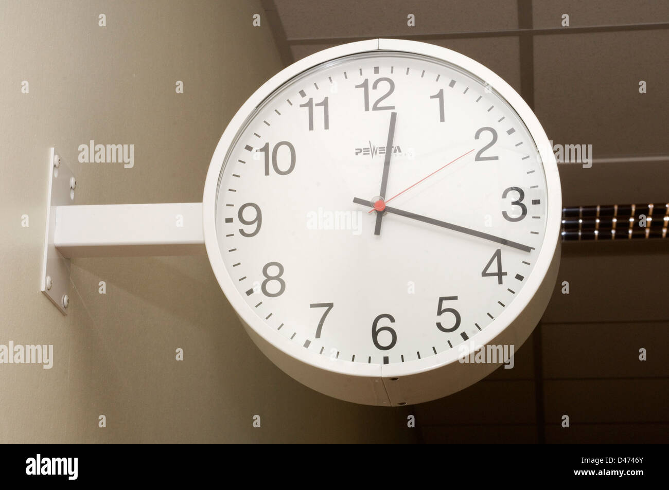 A traditional wallmounted hospital clock Stock Photo Alamy