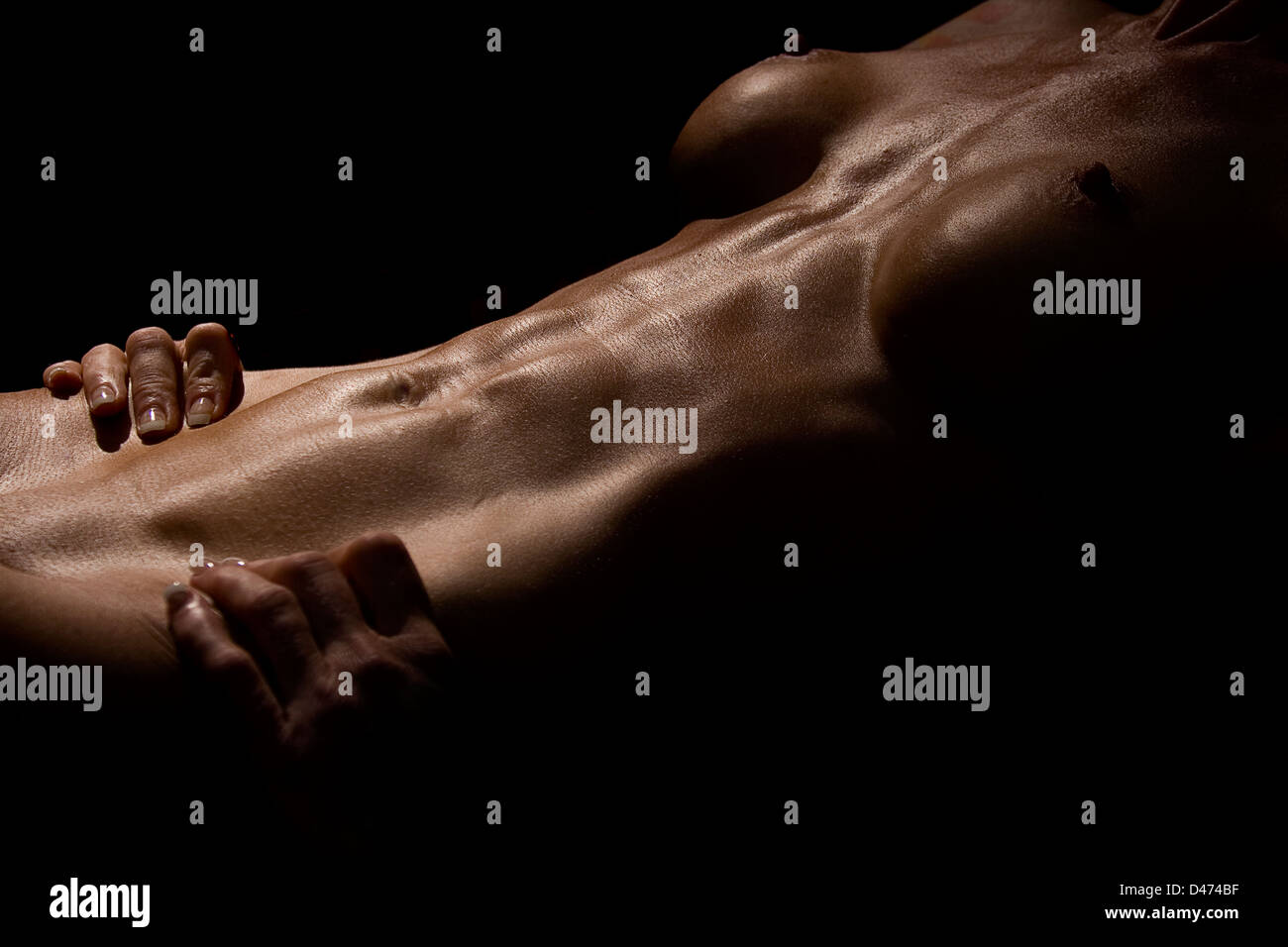 Beautiful fitness inspired image of a toned naked woman with well defined  abdominal muscles Stock Photo - Alamy