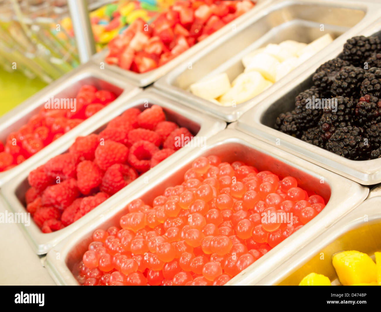 ‎Frozen yogurt toppings bar. Yogurt toppings ranging from fresh fruits