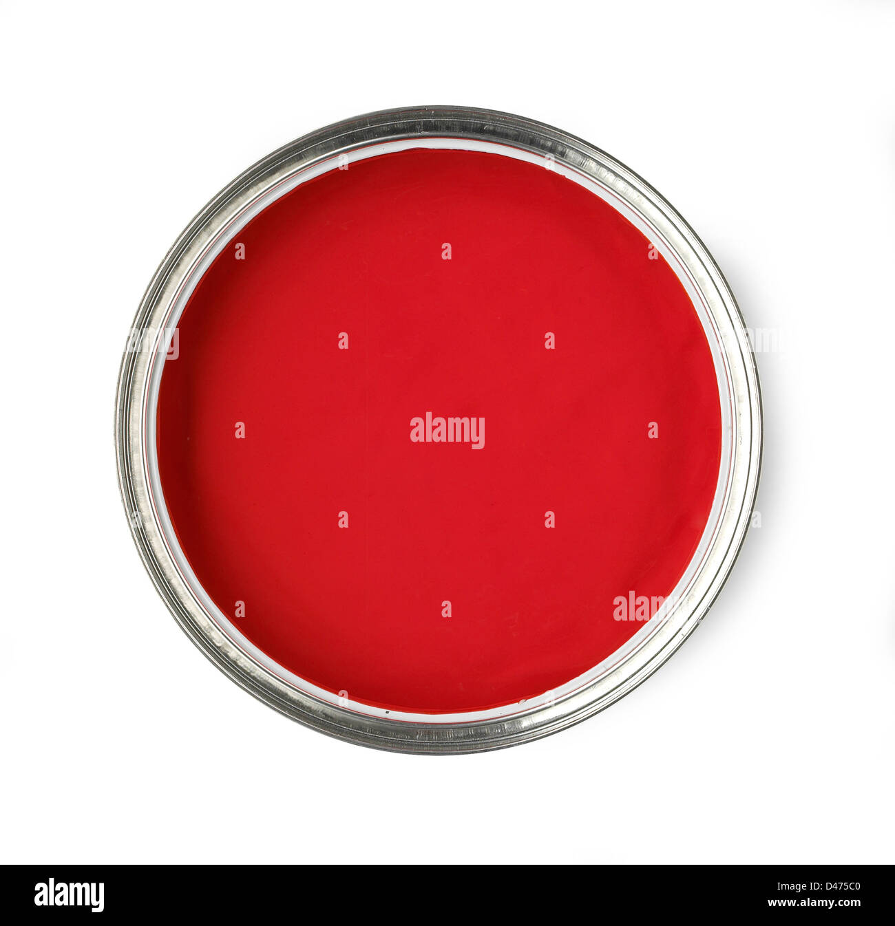 Overhead view of opened pot of red paint cut out white background Stock Photo