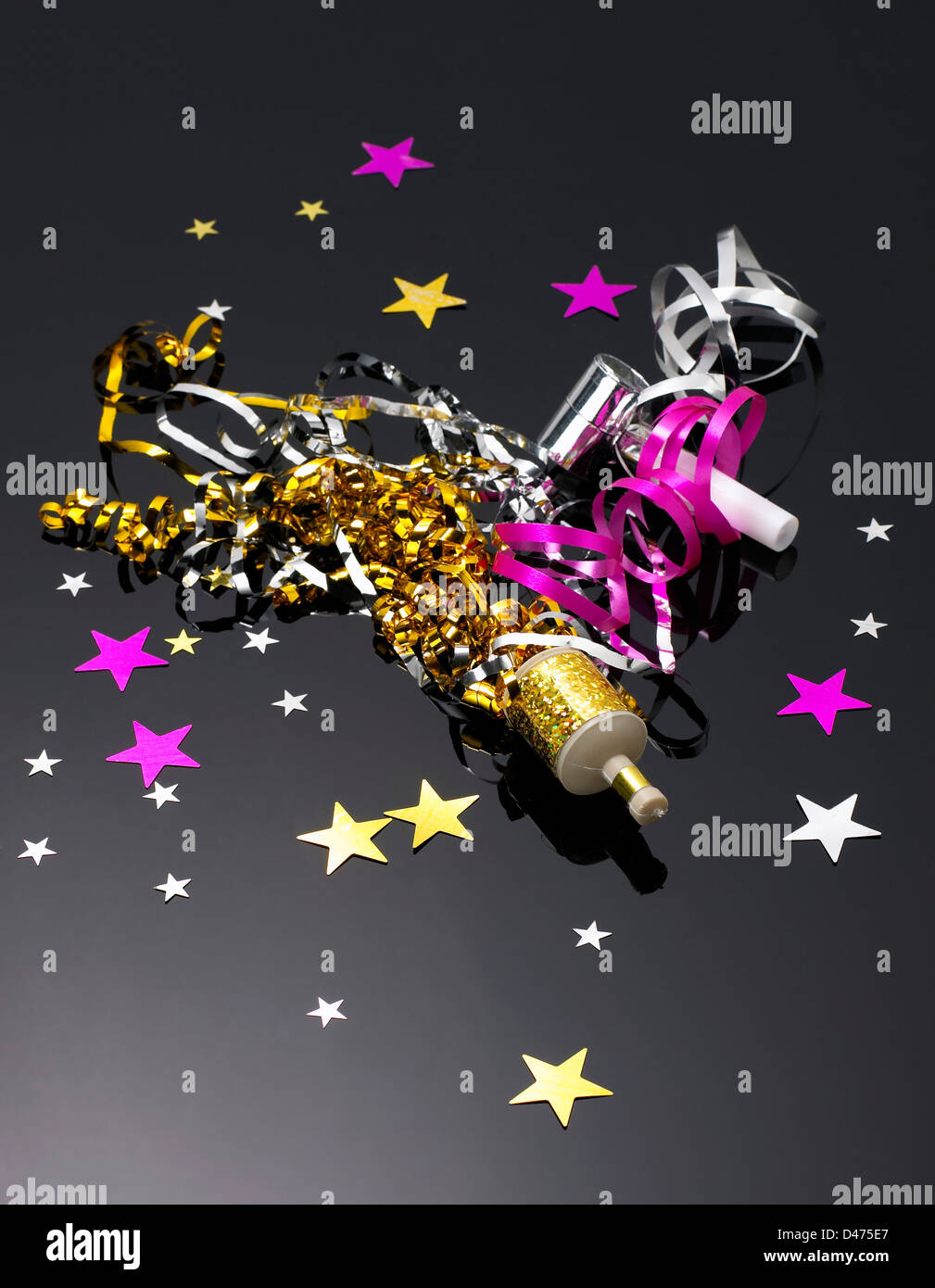 Party poppers with contents cut out black background Stock Photo