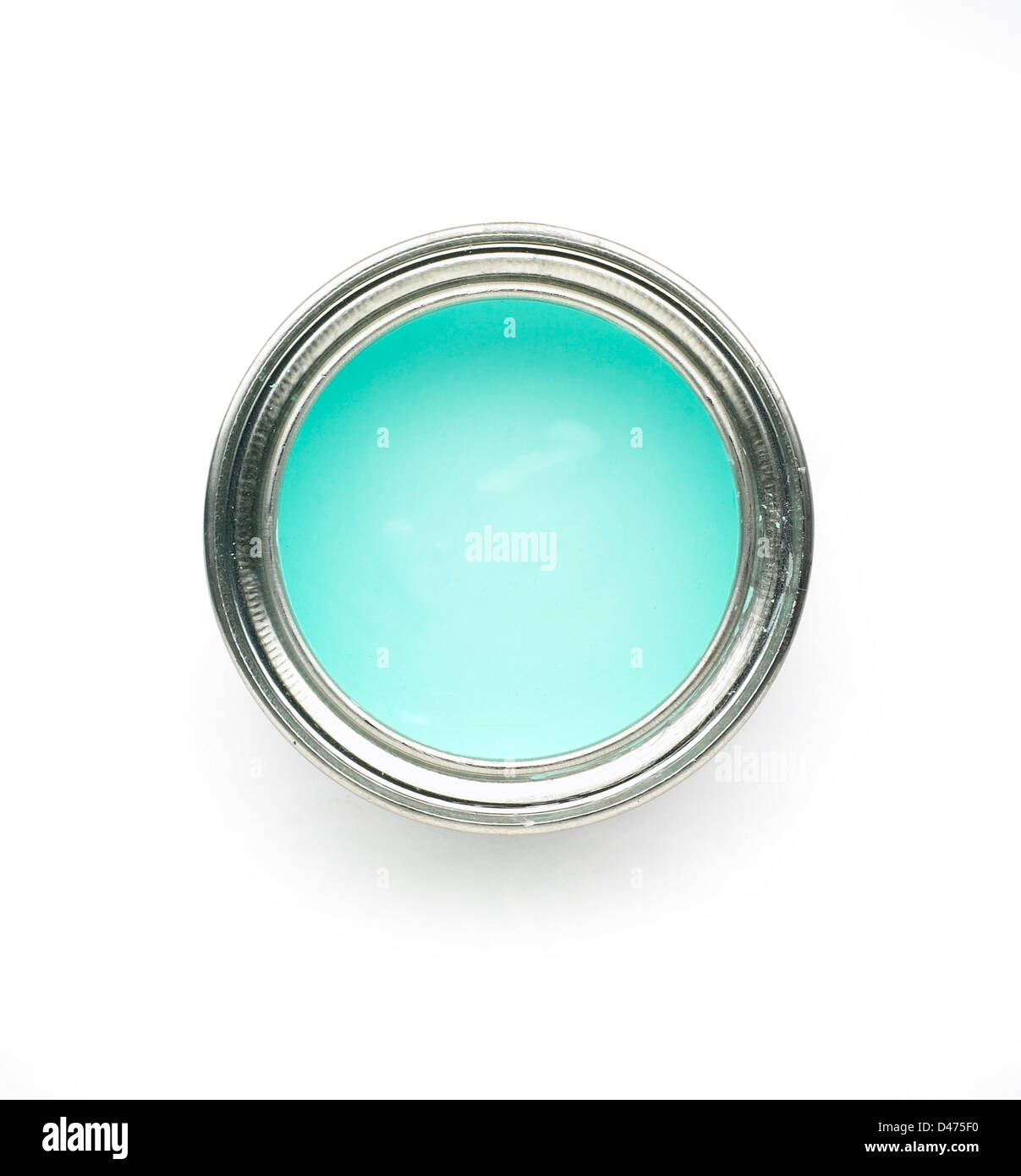 Overhead view of turquoise paint tin cut out white background Stock Photo