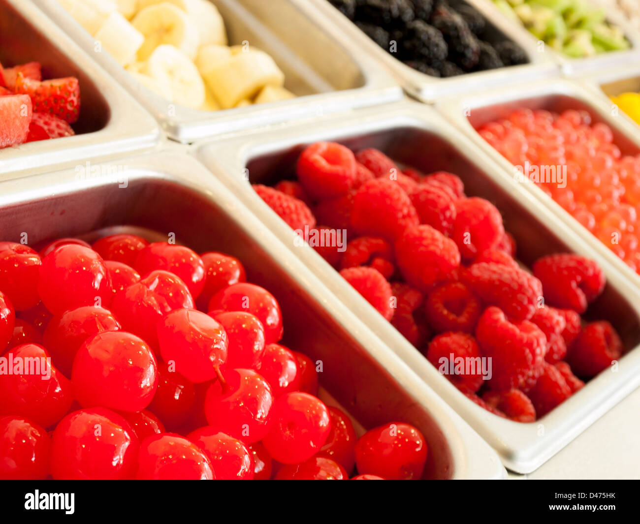 ‎Frozen yogurt toppings bar. Yogurt toppings ranging from fresh fruits