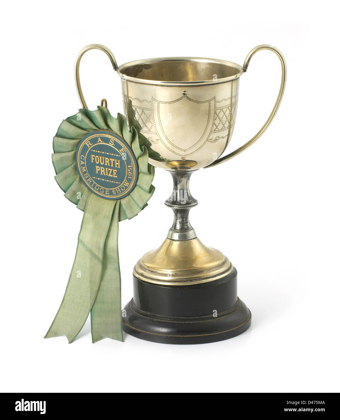 gold cup with rosette cut out white background Stock Photo