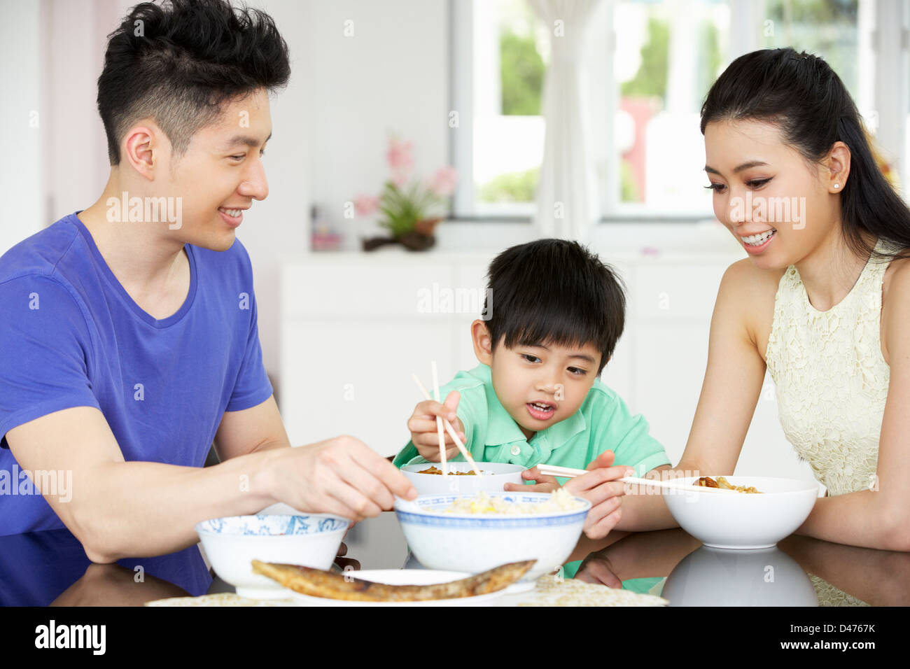 Chinese father and son eating rice hi-res stock photography and images ...