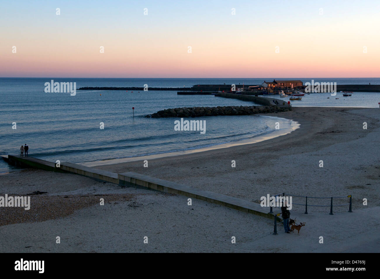 Sunset after a perfect winter day in Lyme Bay is a famous local fishing port and holiday destination. Lyme Regis, Dorset Stock Photo