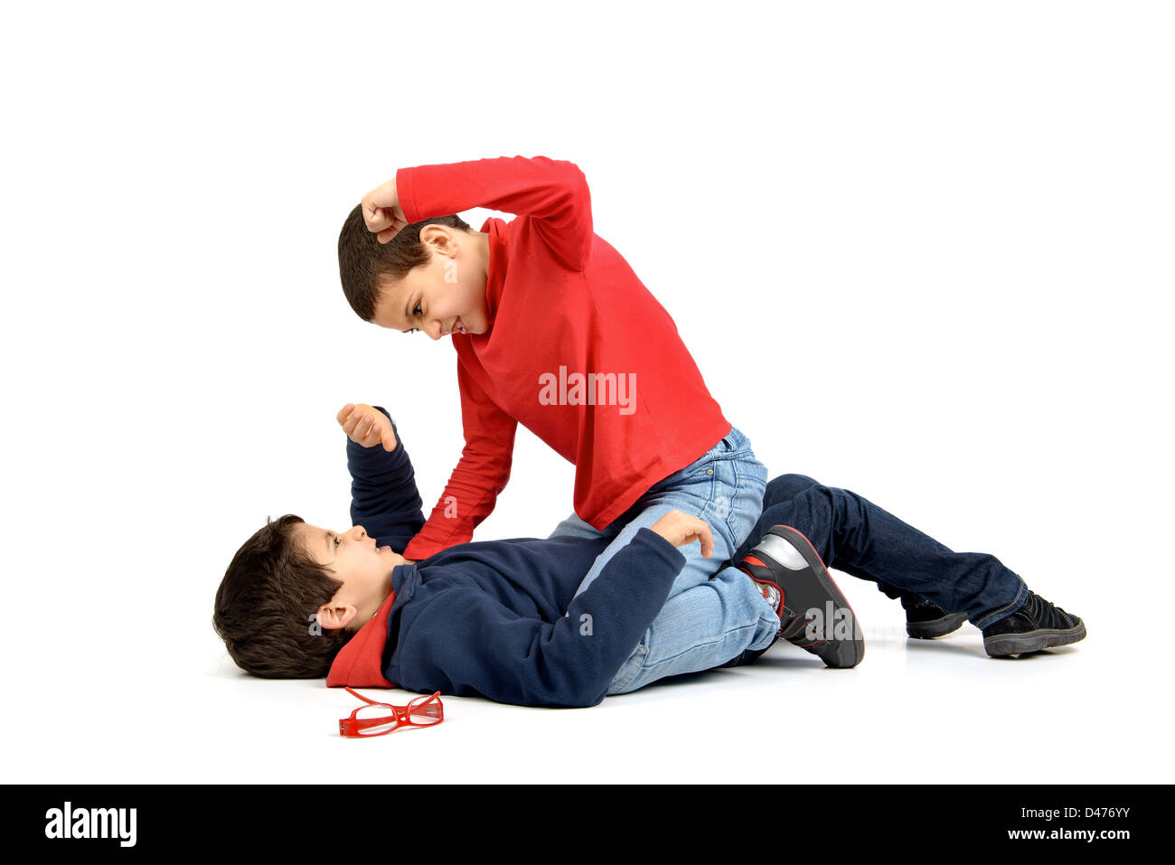 Two boys fighting isolated in white Stock Photo