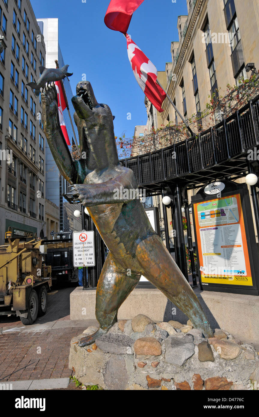 Iconic bear with fish statue at Sparks Street Mall entrance in downtown