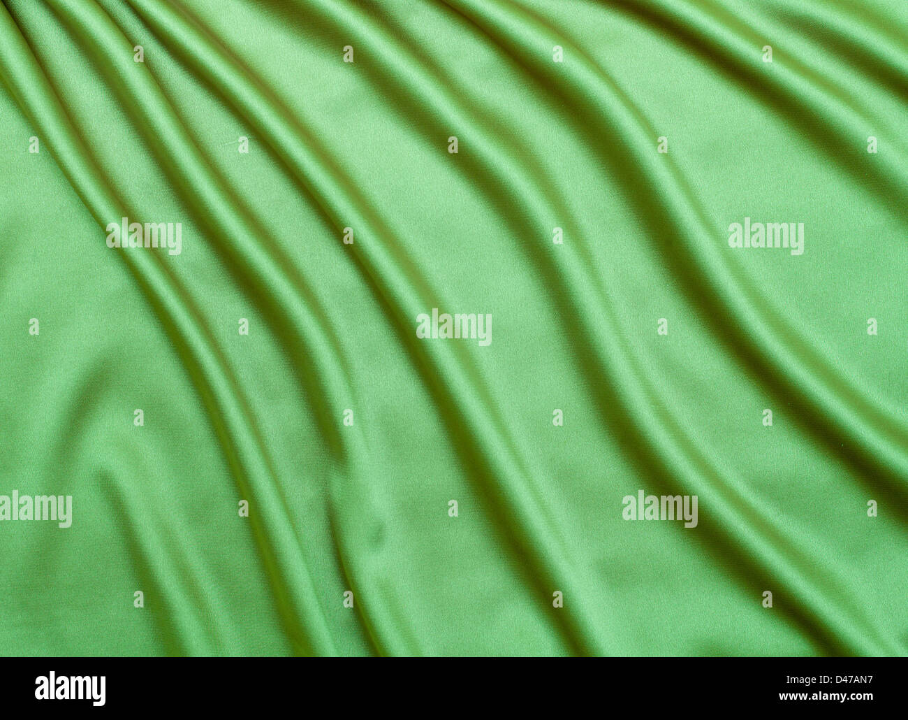 green satin or silk fabric background Stock Photo