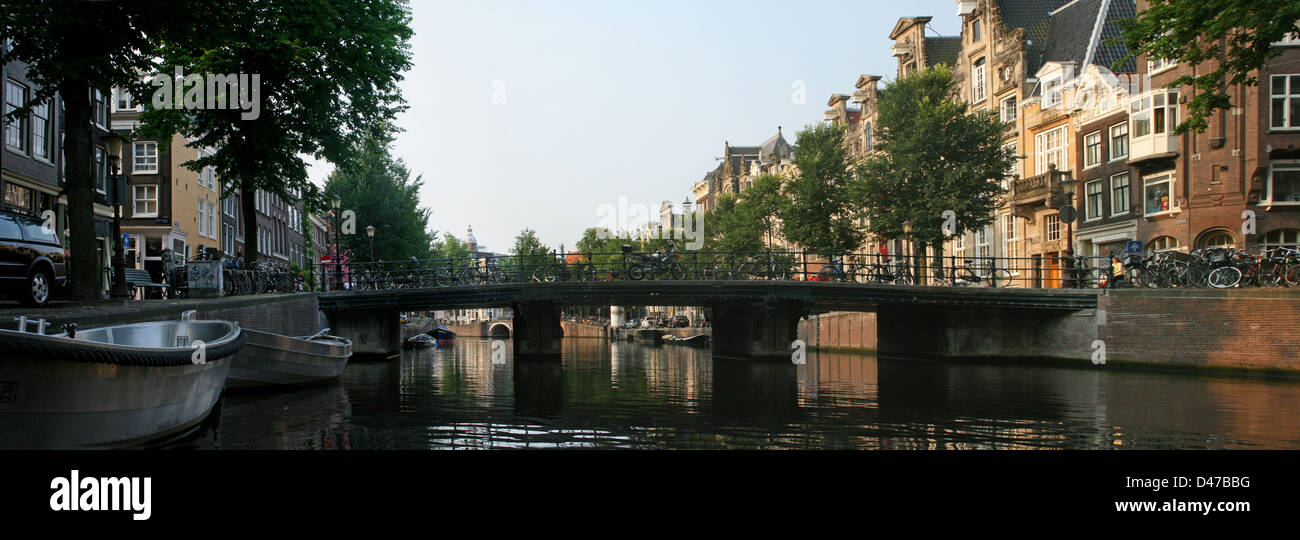 The Netherlands Holland Amsterdam Bridge Herengracht Canal District Boats Bikes Bicycles Stock Photo