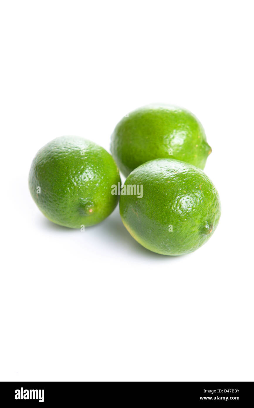 Limes cut in half isolated on white Stock Photo Alamy