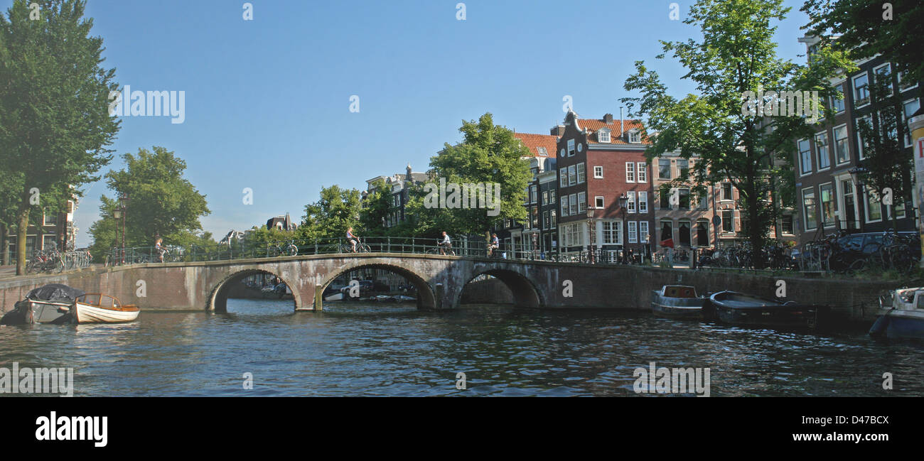 The Netherlands Holland Amsterdam Bridge Keizersgracht Canal District Boats Bikes Bicycles Stock Photo