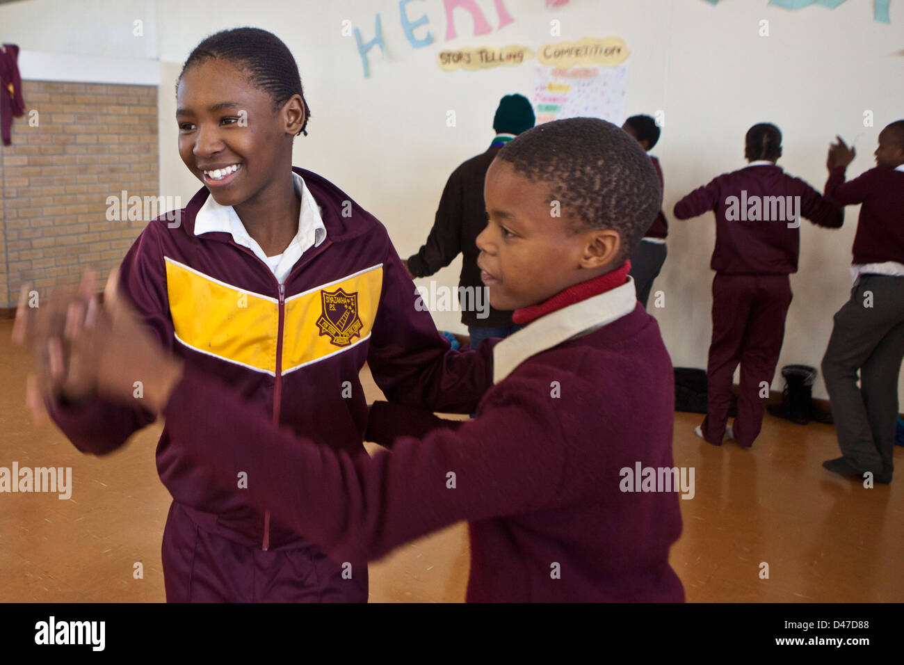 South African school children ballroom dancing in their first ever dance class. Part of a program to improve their education. Stock Photo