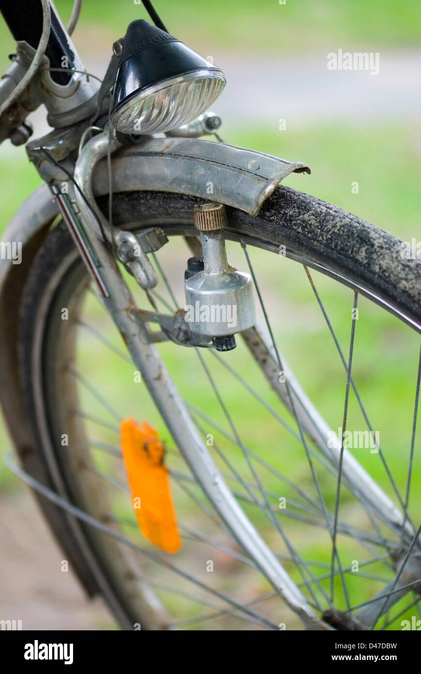 Close up of bicycle wheel with dynamo Stock Photo
