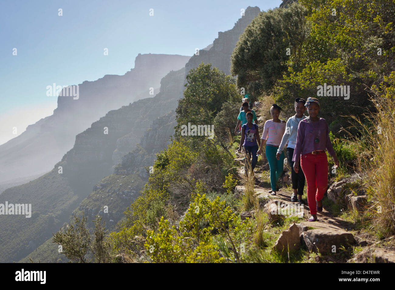 South African high school children hike up Table Mountain, Cape Town, South Africa. Part of environmental education program. Stock Photo