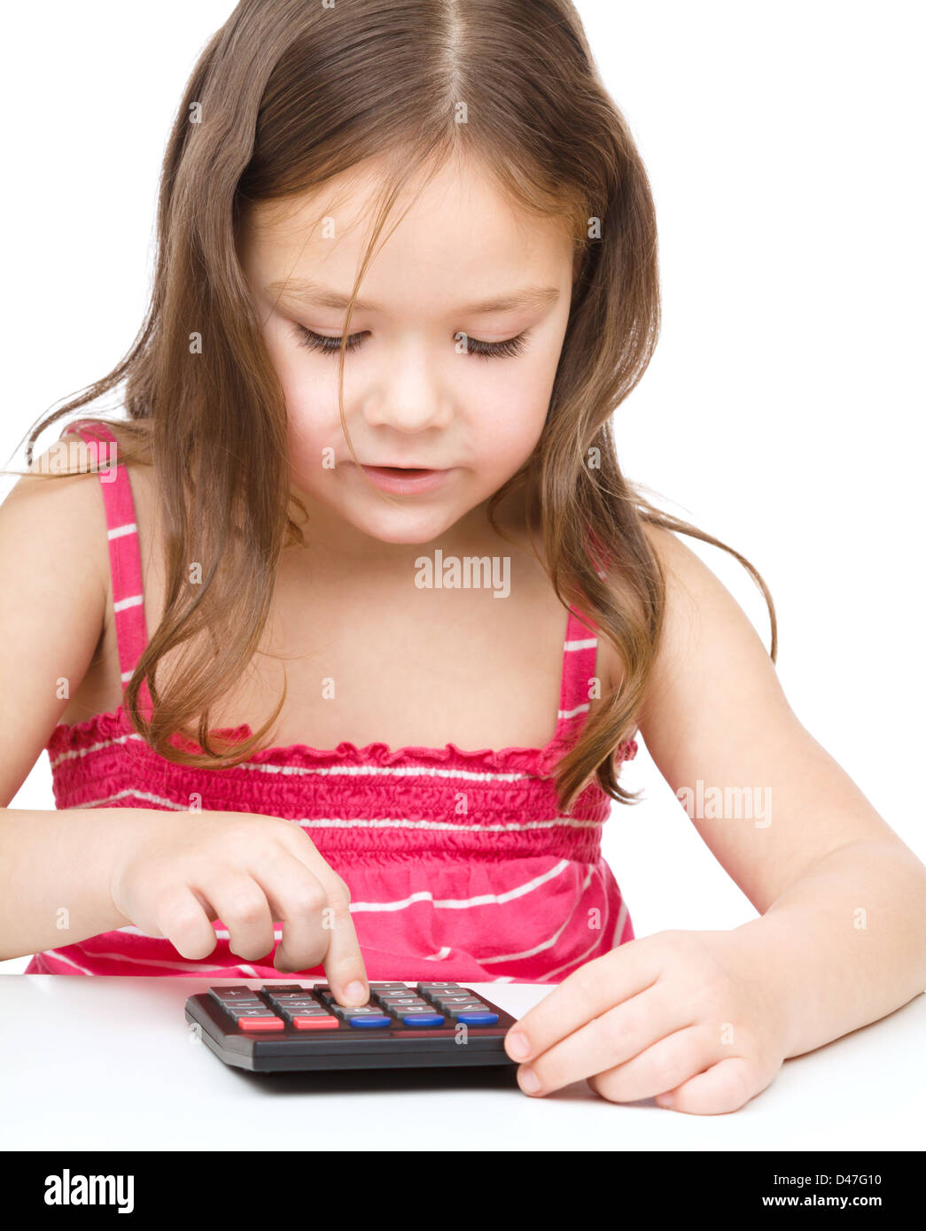 Little girl is using calculator, isolated over white Stock Photo Alamy
