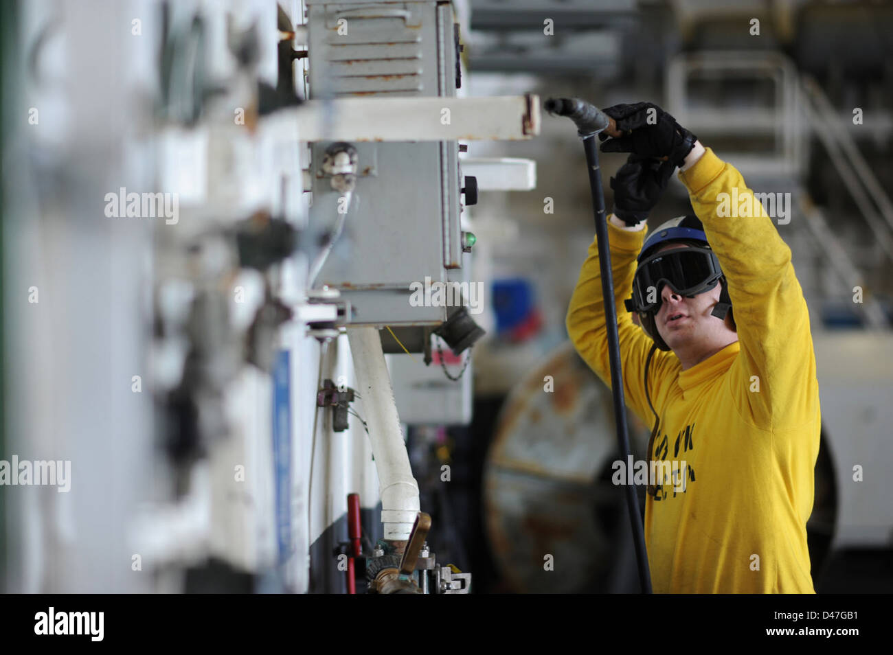 Aviation Boatswain's Mate (Handling) 3rd Class Ryan A. Jones uses a low